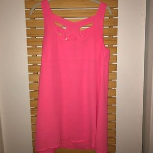 Neon pink dress with geometric neckline.